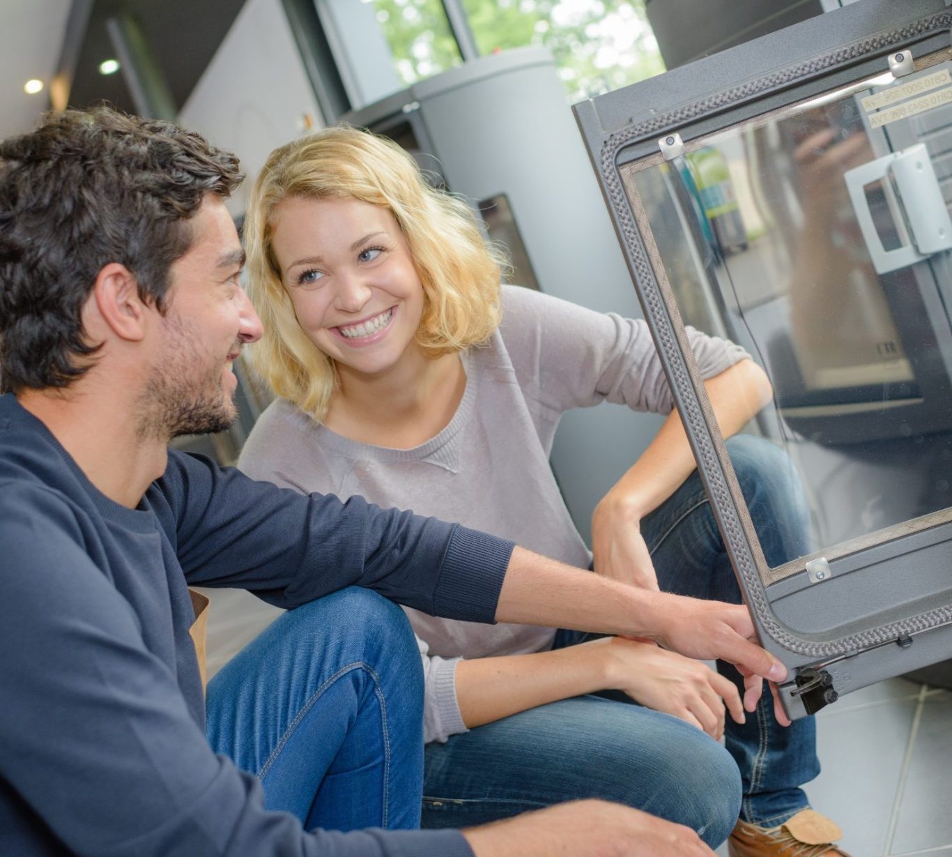 young couple choosing new wood burner